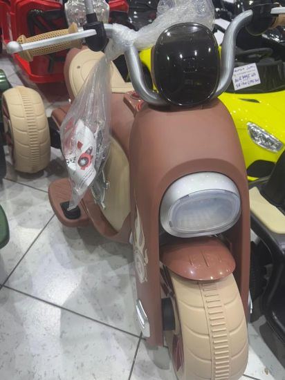 صورة دباب أطفال كهربائي ثلاثي العجلات